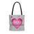 Tote Bag With "Love is a Superpower" Message front view